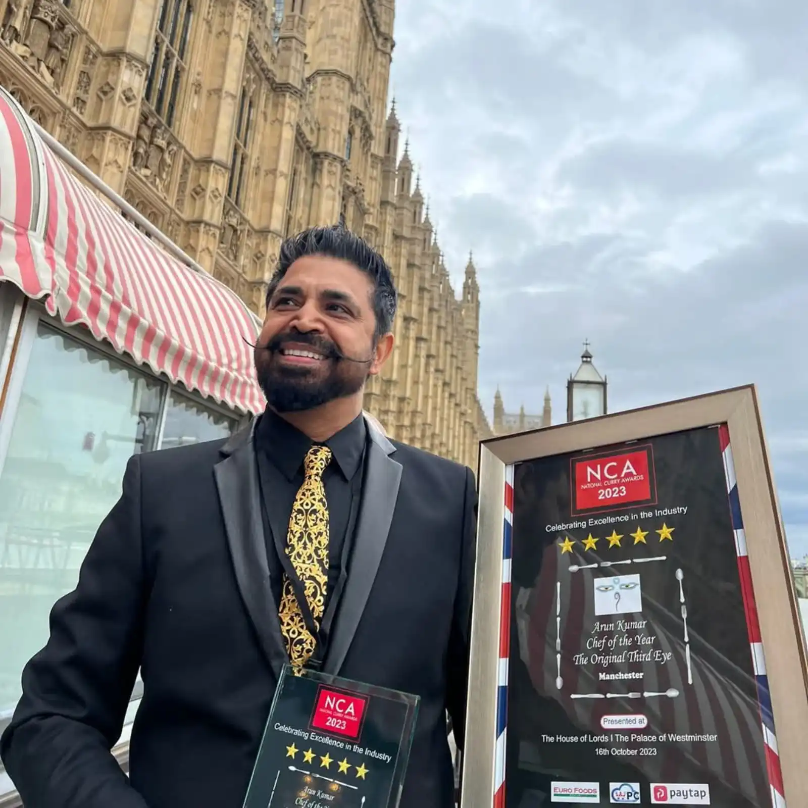 Third Eye Restaurant owner holding National Curry Awards 2023